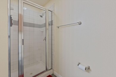 Full bath with a shower stall