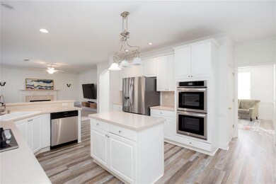 Kitchen with light wood-type flooring, ornamental 