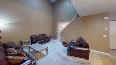 Two-story ceiling in living room w/skylights