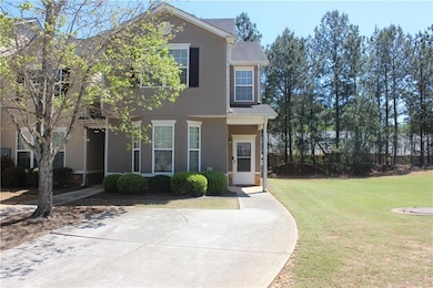 Traditional-style home with a front yard and stucco siding