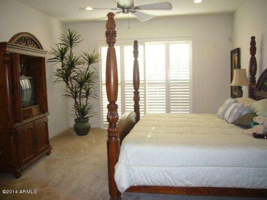 master bedroom with plantation shutters