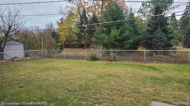 View of fenced backyard