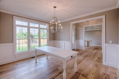 The formal dining room has wide plank Andalusia Oa