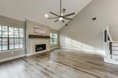 This spacious living room features high vaulted ce