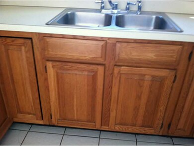Kitchen. WHITE TILE FLOORS FLOW FROM KITCHEN TO TH