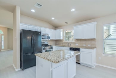 Kitchen featuring stainless steel appliances, a s