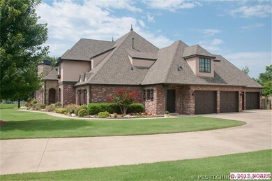 Boasting a side load 4 car garage,  this side of t