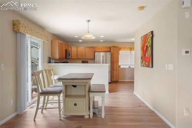 Kitchen featuring a breakfast bar area, appliances