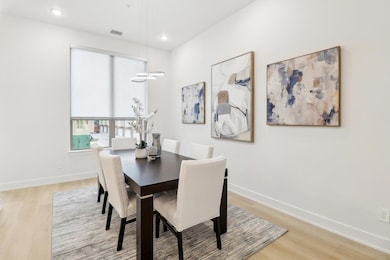 Dining space with recessed lighting, light wood-ty