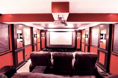 This theater room decked in Chinese red and black 