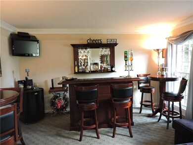 Quaint formal living room set up as an English Pub