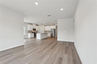 Unfurnished living room with baseboards, recessed 