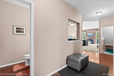 Hallway featuring wood finished floors and baseboards