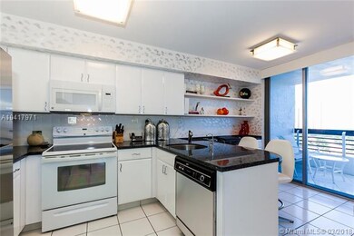 Modern kitchen which includes a breakfast area.