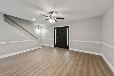 View of front room from kitchen.
