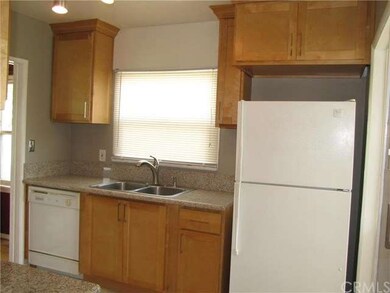 New tile floors, granite countertops and wood cabi