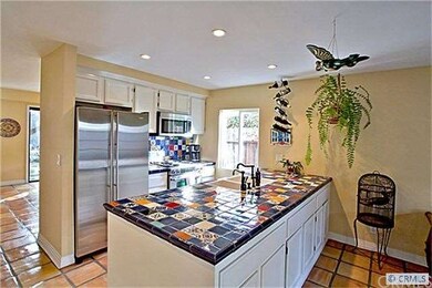 Open kitchen w/custom Spanish tiles and high-end s