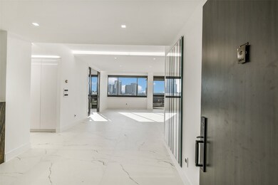 Welcome to this stunning 19th-floor penthouse to find an inviting entry that opens to expansive living and dining areas framed by abundance of windows. The open layout immediately draws your eye to the sweeping skyline views, while the sophisticated finishes and natural light set a tone of modern elegance throughout.