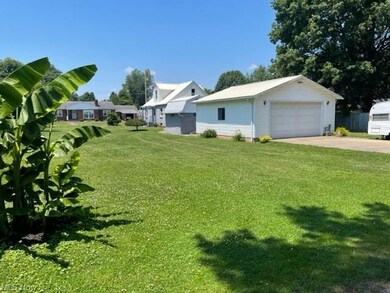 View of huge yard, garage, and storage building