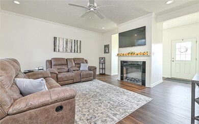 Living room features cozy electric fireplace.  Giv