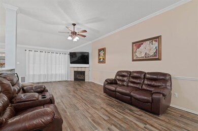 Living room featuring ornamental molding, lofted c