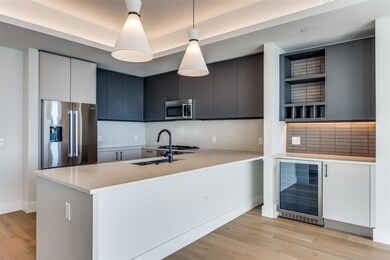 Kitchen featuring pendant lighting, tasteful backs