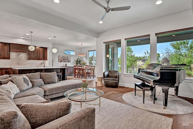 Living room featuring wood finished floors, recessed lighting, plenty of natural light, and ceiling fan