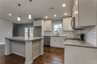 Granite countertops, stainless appliances, new cab