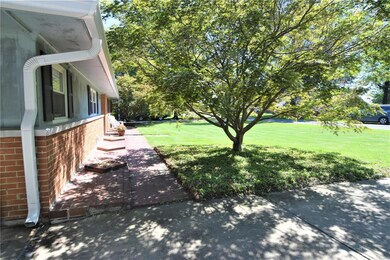 A short brick walkway to the front door.