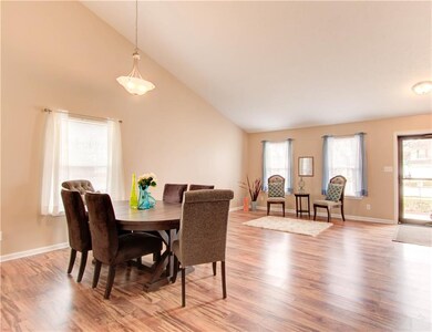 Use this space as it fits your style and needs.  It is a living room/dining room space or it can be one large great room.