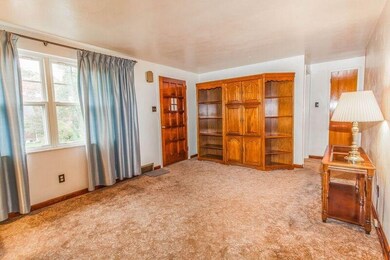 Living Room view towards the front door and Bedroo