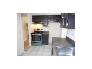 This kitchen features plenty of cabinets and count