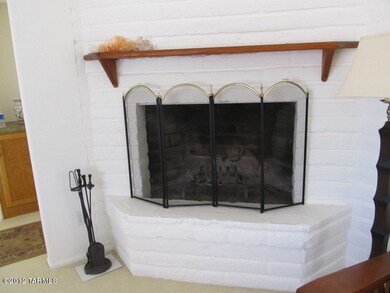 Woodburning fireplace in living room.