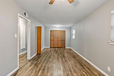 Hall featuring hardwood / wood-style flooring and 