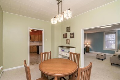 Spacious dining room with updated lighting is the 