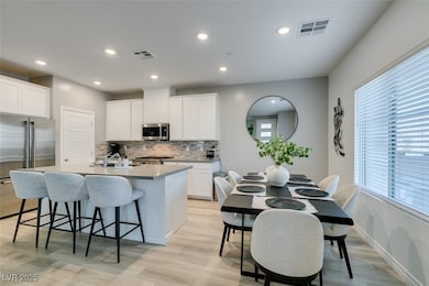 Kitchen featuring appliances with stainless steel