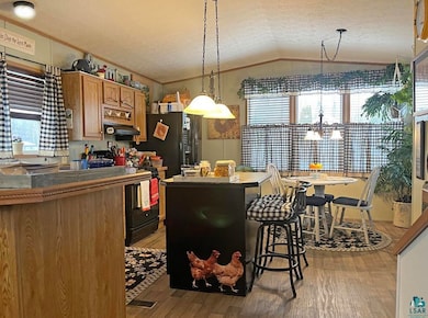 Kitchen featuring a textured ceiling, a healthy am