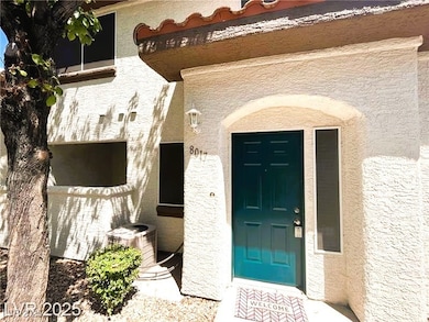 Entrance to property featuring stucco siding