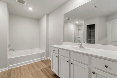 Luxurious primary bathroom with a soaking tub.