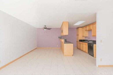 The living room is wide open to both; the kitchen 