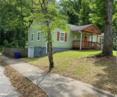 View of front of home featuring a porch, a shingle