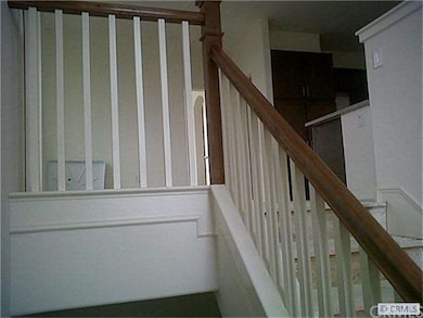 Upgraded Stained Handrails to match cabinetry thro