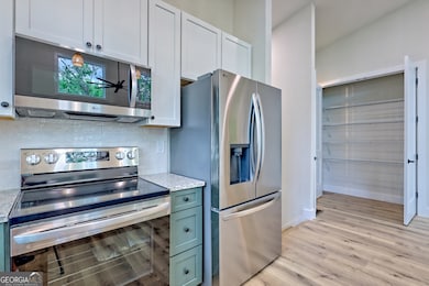 Kitchen looking toward pantry