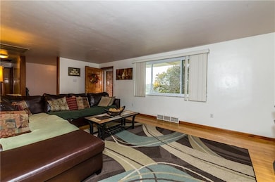 Another picture of the living room showing the ove