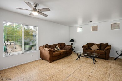 Living room with baseboards, light tile patterned