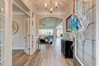 Foyer featuring wood-type flooring, ornamental mol