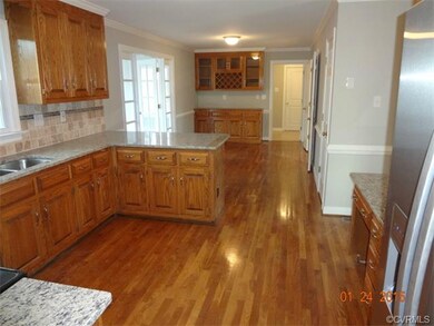Kitchen overlooking eat-in area with wet bar
