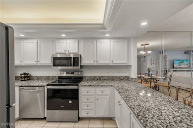 Kitchen with pendant lighting, stainless steel app