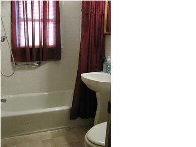 Updated bathroom with full tub and shower