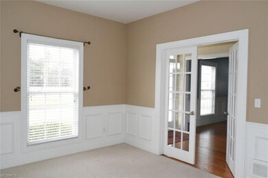French doors give way into the nice, sunlit living